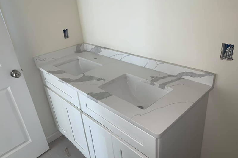 Elegant quartz bathroom countertop with integrated sink and modern faucet
