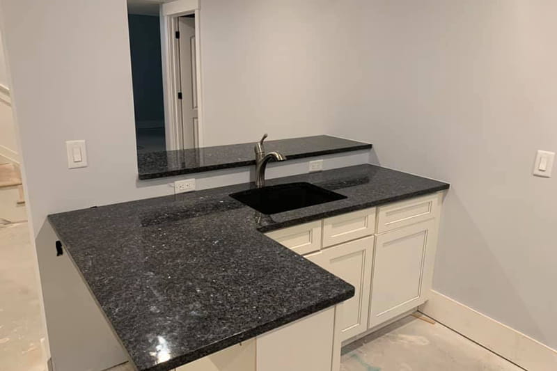 Sleek modern kitchen countertops in engineered stone with clean lines