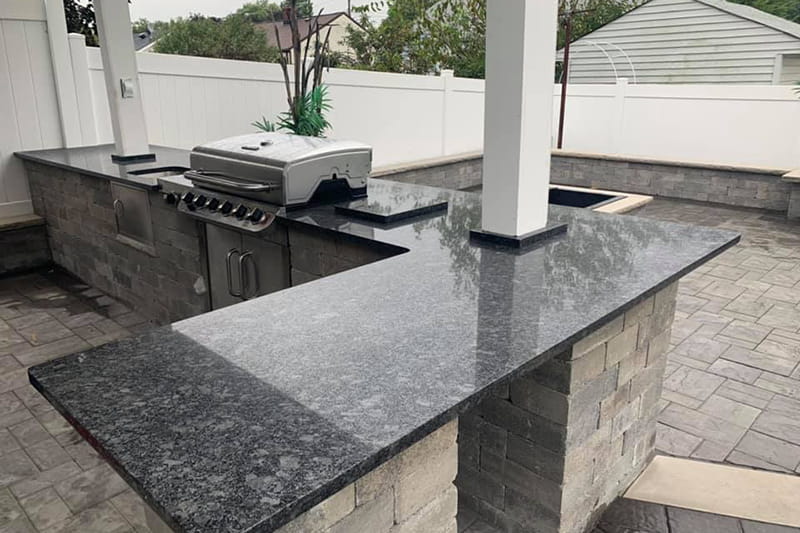 Durable quartz kitchen countertops with elegant backsplash in a luxury kitchen